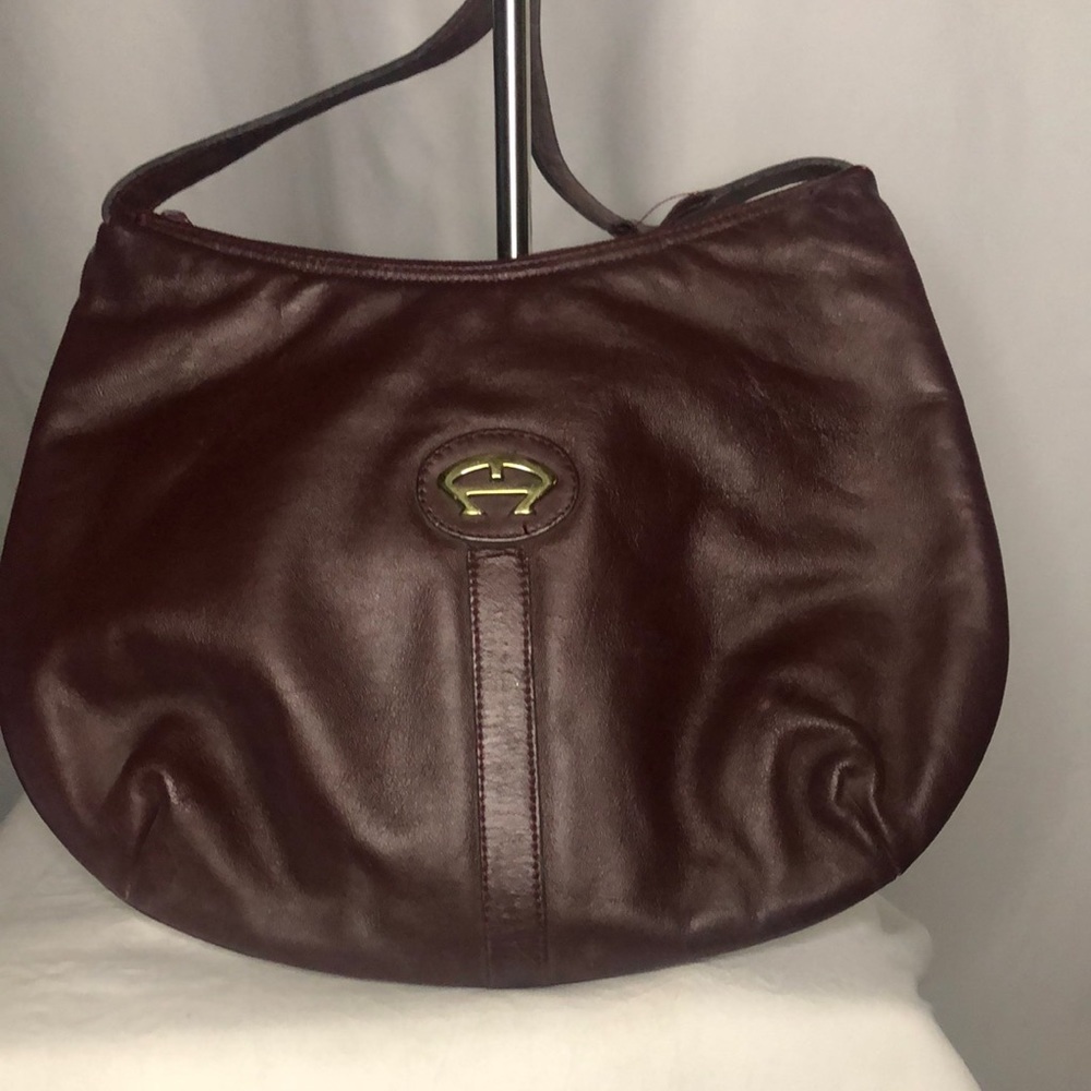 ETIENNE AIGNER Vintage burgundy leather crossbody handbag.